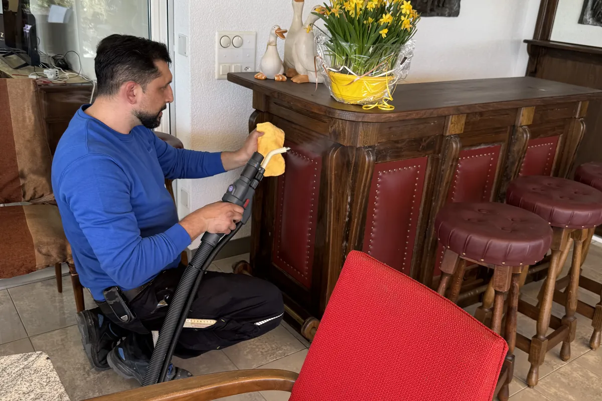 Arnel Zimmermann using steam cleaning equipment